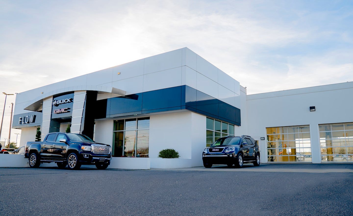 Flow Buick GMC dealership building with white exterior