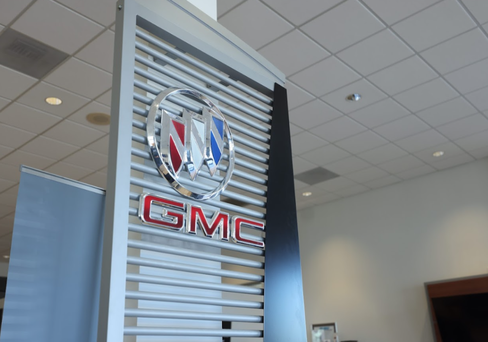 Buick and GMC logos inside the showroom of Flow Buick GMC of Winston-Salem