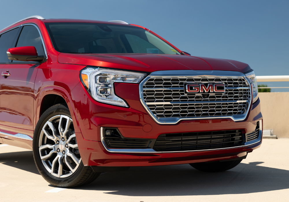 Close up of the front of a red GMC SUV